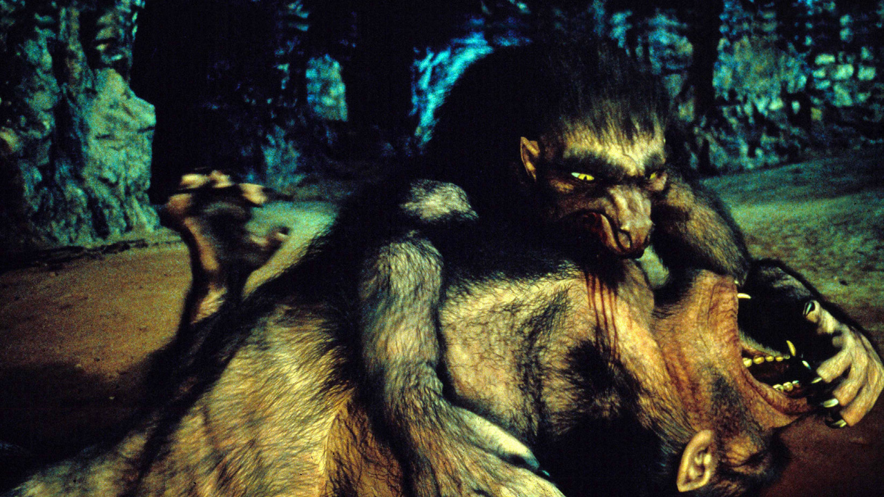 A werewolf biting another werewolf’s neck, scene from An American Werewolf in Paris